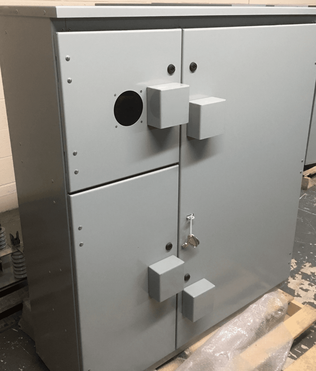 Metal metering enclosure with meter opening and service compartments